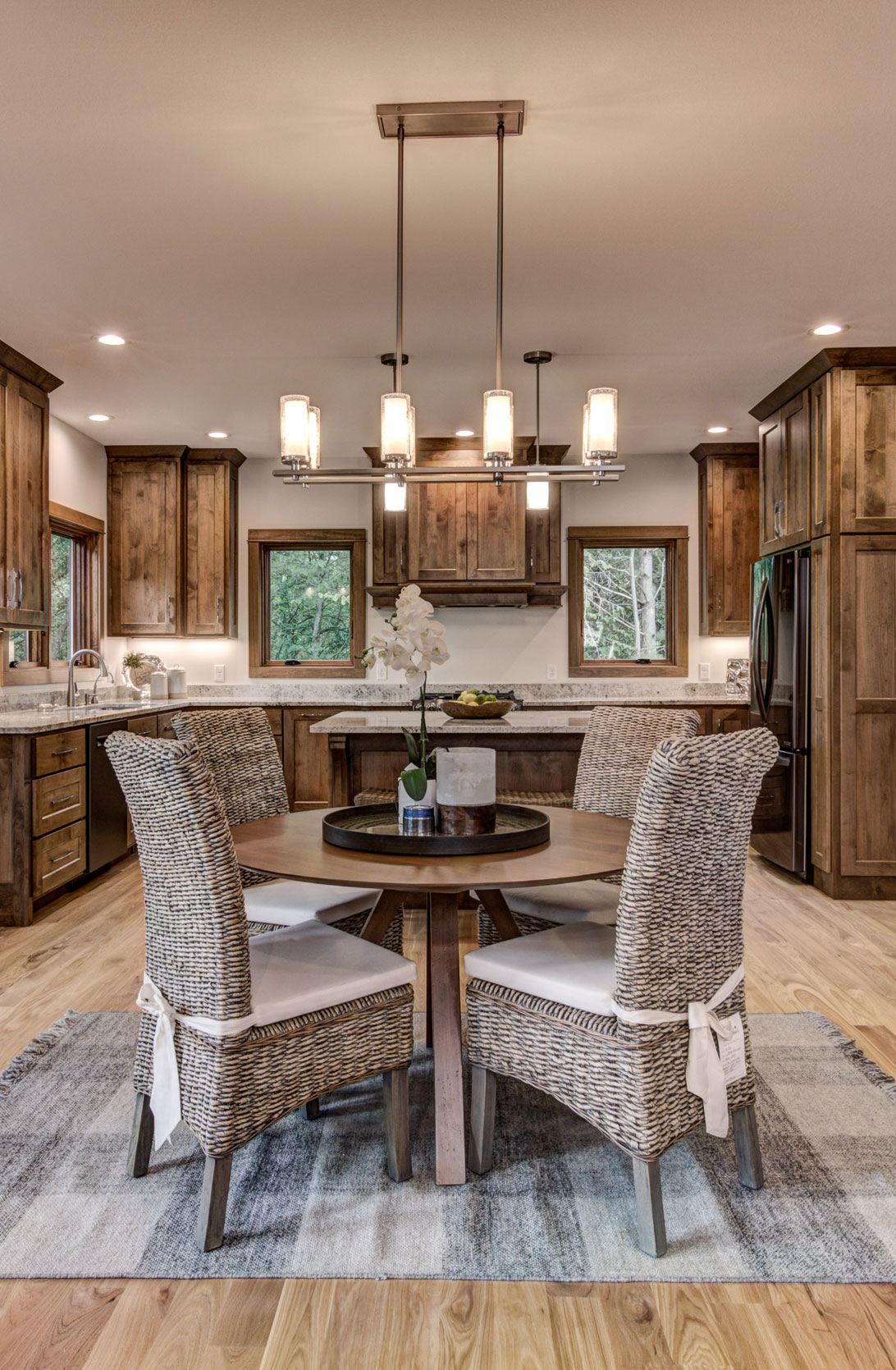 Dining room table in front of kitchen