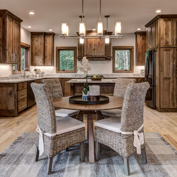 Dinning room table with kitchen in the background