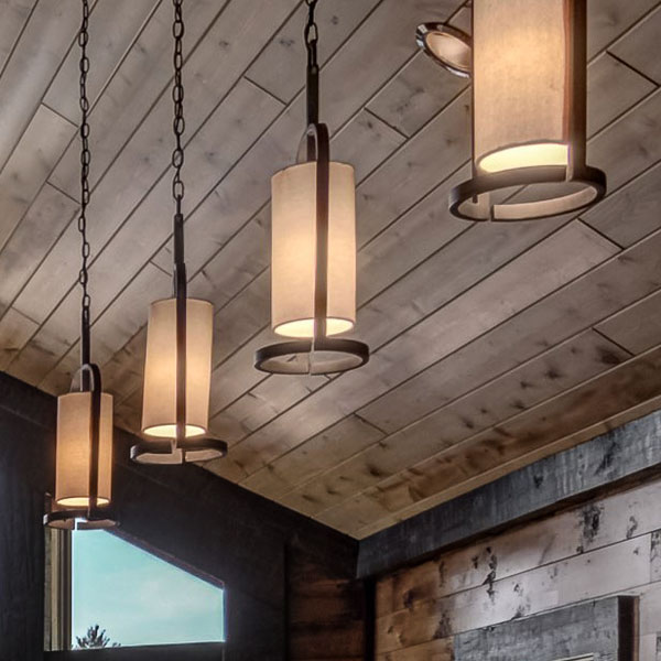 Wood ceiling with four hanging light fixures